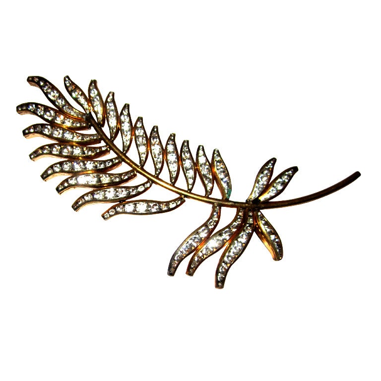Elegant Gold-Toned Leaf Brooch with Clear Rhinestones For Sale