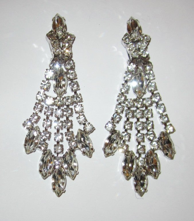 This is a pair of brilliant clear rhinestone shoulder-duster clip-on earrings. Each earring measures 3.25