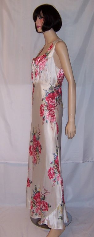 This is gorgeous 1930's vintage, bias-cut white nightgown  with oversized deep pink cabbage roses repeated throughout the design. The gown measures 39