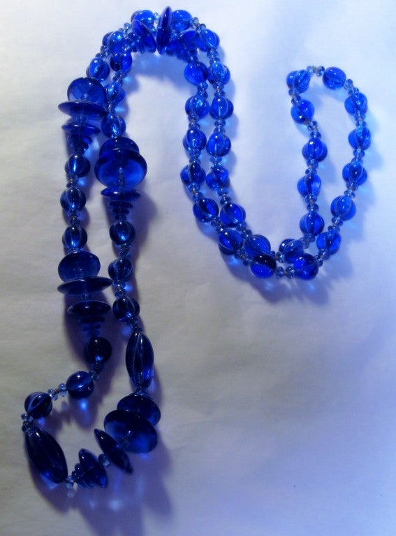 This is an incredibly beautiful, 1920's vintage, cobalt blue molded/poured glass sautoir measuring 18