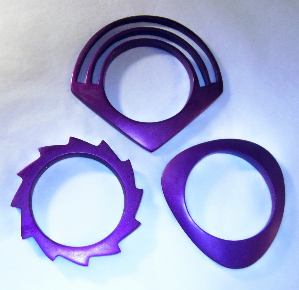 This is a fantastic grouping of three purple, brushed aluminum bangles from the 1980's vintage.  Each bangle measures approximately 7.85