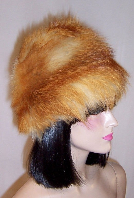 This is an extraordinarily beautiful, 1960's vintage , red, white, and gray fox fur hat in excellent vintage condition.  Its crown measures 8