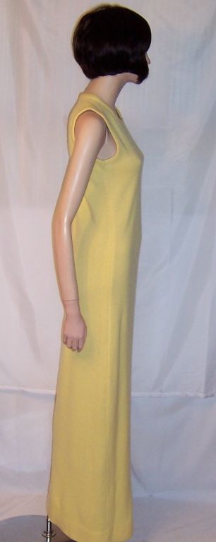 This is a buttery soft 100% cashmere, canary yellow sleeveless sweater dress designed by Halston in 1972, and made in Scotland. Halston became synonymous with American style and had been known for his modern, minimal yet glamourous designs.

This