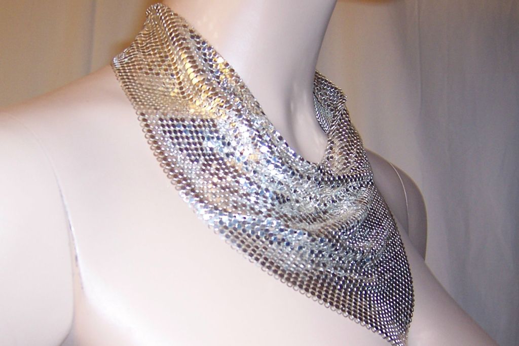 This is a striking Whiting & Davis silver metal mesh collar/bib necklace. The tag is present and marked Whiting & Davis and the collar is in excellent vintage condition.