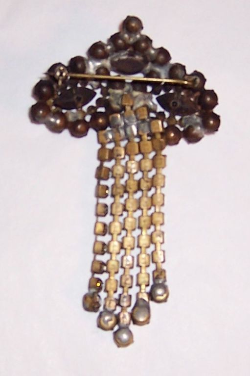 This is a striking Art Deco dangle brooch with jet and clear rhinstones. The brooch measures 2 1/2