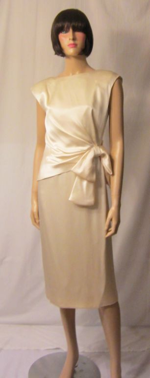 This is a gorgeous, simple, and elegant soft white silk charmeuse cocktail/wedding dress masterfully designed for Giorgio of Beverly Hills. The design is strikingly simple and the fabric is buttery soft and luxurious. Giorgio of Beverly Hills was a