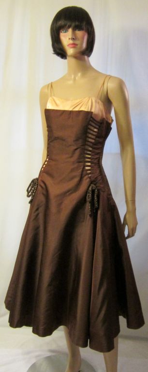 This is a very unusual 1950's vintage, brown and pink taffeta gown designed by Perullo for David Hart, Inc. I believe that this company dealt mainly in prom and ball gowns. The gown has a variety of interesting details including a double bodice, the