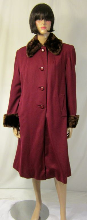 This is a fabulous 1940's, Barclay Exclusive, maroon woolen coat with exceptional detailing and fur trimmed collar and cuffs, sold at Orr's of Easton, PA. The coat would be comparable to a Size 6/8 and is in excellent vintage condition.