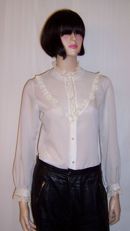 This is a gorgeous blouse, custom-made, in the Victorian style using antique pintucking techniques and antique Valenciennes lace trim on heavy crepe chiffon. The blouse has snaps and tiny pearl buttons down the front for closure and pearl buttons at