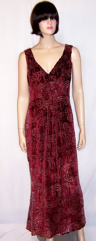 This is an amazingly beautiful Escada maroon and silver voided silk velvet gown on silk chiffon, reminicient of the Art Deco period. It is simple, yet elegant in its design. The gown is sleeveless with a very flattering V neckline and some tucking