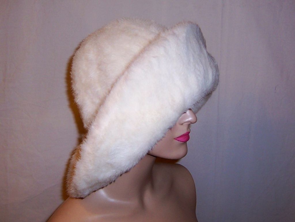 This is a dramatic and unusally large white, wide brimmed faux fur hat with a John Wanamaker label. John Wanamaker has been credited with pioneering the creation of the department store and opened the first department store in 1861 in Philadelphia.