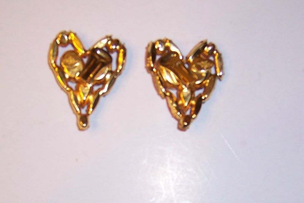 These are over-sized, heart-shaped earrings by Davd Mandel, stamped 