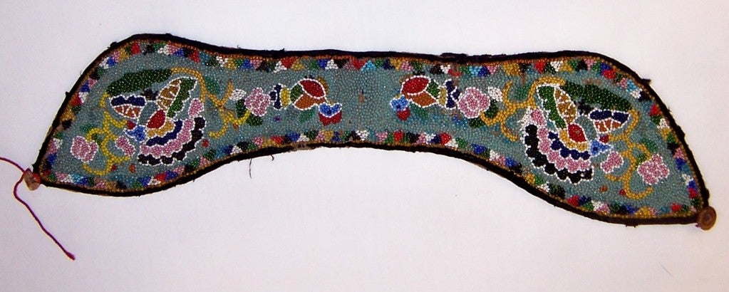 This is a lovely glass beaded headpiece/headband from the southern Hunan province of China, dating to approximately the 1920's. The Hunan province area had been known for their exquisite beadwork. This headpiece measures 14 1/2