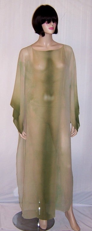 This is an incredibly beautiful 1920's vintage, hand-dyed moss green, silk chiffon caftan. The construction is simple but the hand-dying must have been executed by a masterful artisan. The deep moss green in the center of the caftan in both the