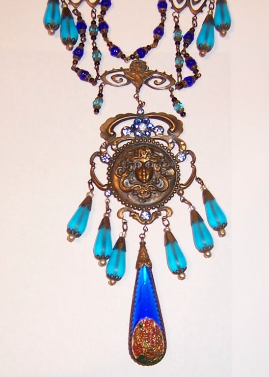 This is an outstanding turquoise and cobalt blue Czechoslovakian bib necklace, circa 1920's-1930's. The design and attention to detail truly exemplify their craftsmanship. The necklace measures 16