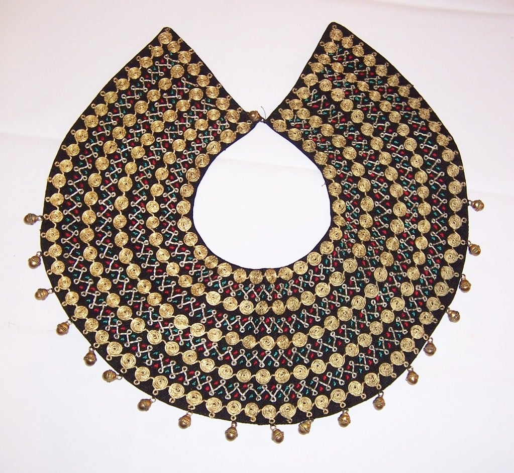 This is an extraordinary hand-made in Israel, gold metallic embroidered collar whose label is present and reads Maskit. Maskit was a fashion house founded by Ruth Dayan, wife of Moshe Dayan, in the early 1950's, as a way of creating jobs for new