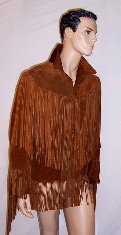 This is a richly colored burnt sienna, men's suede, long fringed 