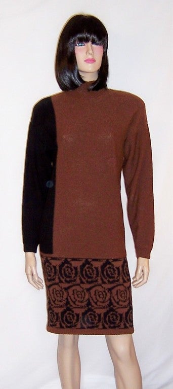 This is another fabulous Steve Fabrikant knitwear ensemble consisting of a dress and matching cardigan in sienna and black, a striking color combination. The outfit consists of a long sleeved turtleneck dress which must be slipped over the head to