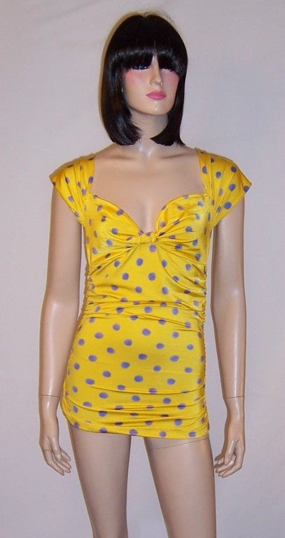 This is a striking bright yellow and lavendar polka-dotted top with a sweetheart neckline and ruched bodice designed by the Italian designer, Emanuel Ungaro, for his Parallele label.  The label in the last photograph is white and not the color