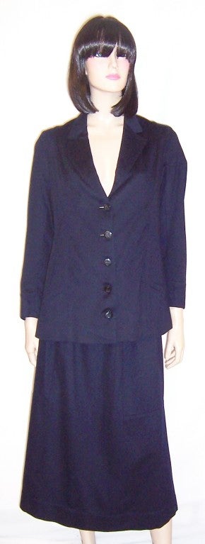 Offered for sale is this beautifully designed woman's Edwardian (1901-1919) midnight navy, woolen walking suit. The suit would be comparable to a modern day Size 6/8 and is in near excellent vintage condition with the exception of a tiny hole the