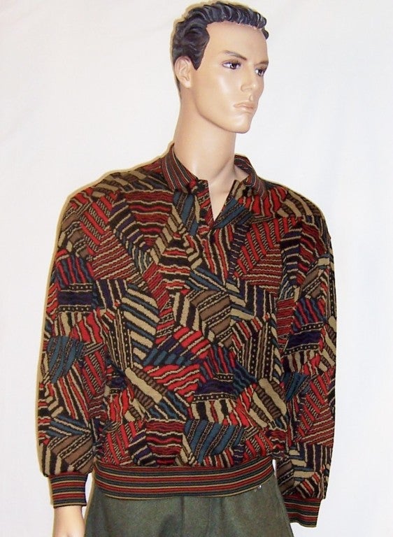 Offered for sale is this wonderful men's multi-colored and patterned pullover sweater in hues of russet red, forest green, tan, and umber. Missoni is known for their mixing of a kaleidoscope of colors and patterns and always achieving a pleasing