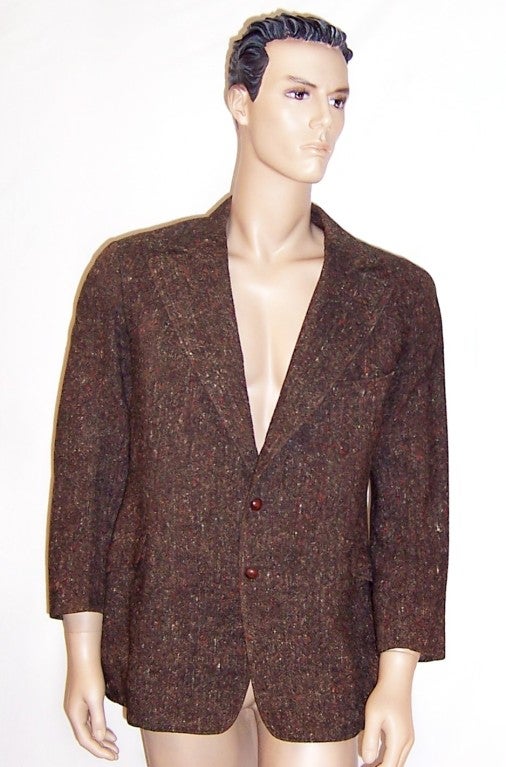 Offered for sale is this handsome, imported Donegal men's tweed jacket dating probably to the late 1930's. Donegal tweed is a handwoven tweed manufactured in County Donegal in Ireland.  Donegal has been producing tweeds for centuries from local