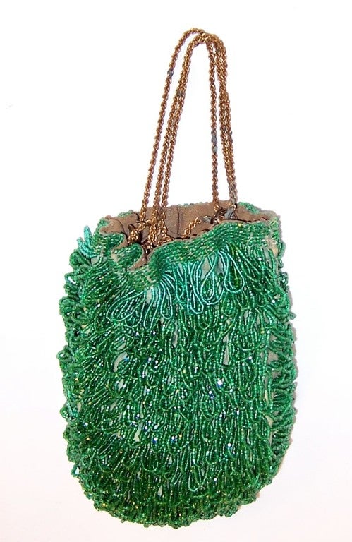 This is a luscious kelly green beaded reticule, drawstring style purse of the 1920's vintage. It measures 8