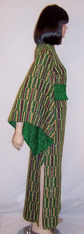 This is an elegant and chic design by Jerry Melitz of Aled Couture of Israel.  His creations always look fresh and original and are designed with a Middle Eastern ethnic flair about them. This metallic knit maxi-dress of violet, kelly green and gold