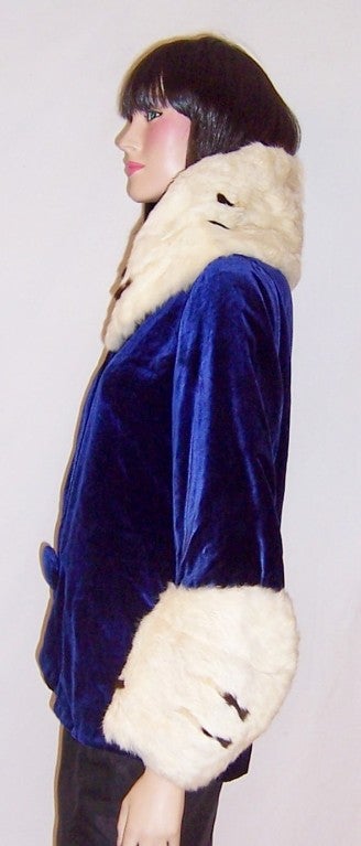 This is a superb 1920's royal blue silk velvet jacket with a huge ermine collar and cuffs.  The collar measures 10