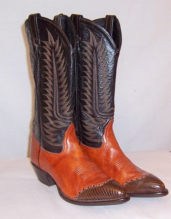 This is a fantastic pair of vintage Tony Lama cowboy boots of burnt sienna and brown, hand crafted in El Paso, Texas.  The intricate stitching, quality, and craftmanship is quite remarkable.  They a marked a Size 7 1/2 M and are in excellent vintage