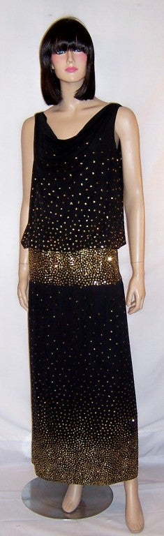 Offered for sale is this eye-catching, sleeveless black evening gown lavishly embellished with tiny gold sequins, designed by Michael Maiello (1948-1989) for Pat Richards.  The gown has a lovely scooped neckline with soft draping and the back has a