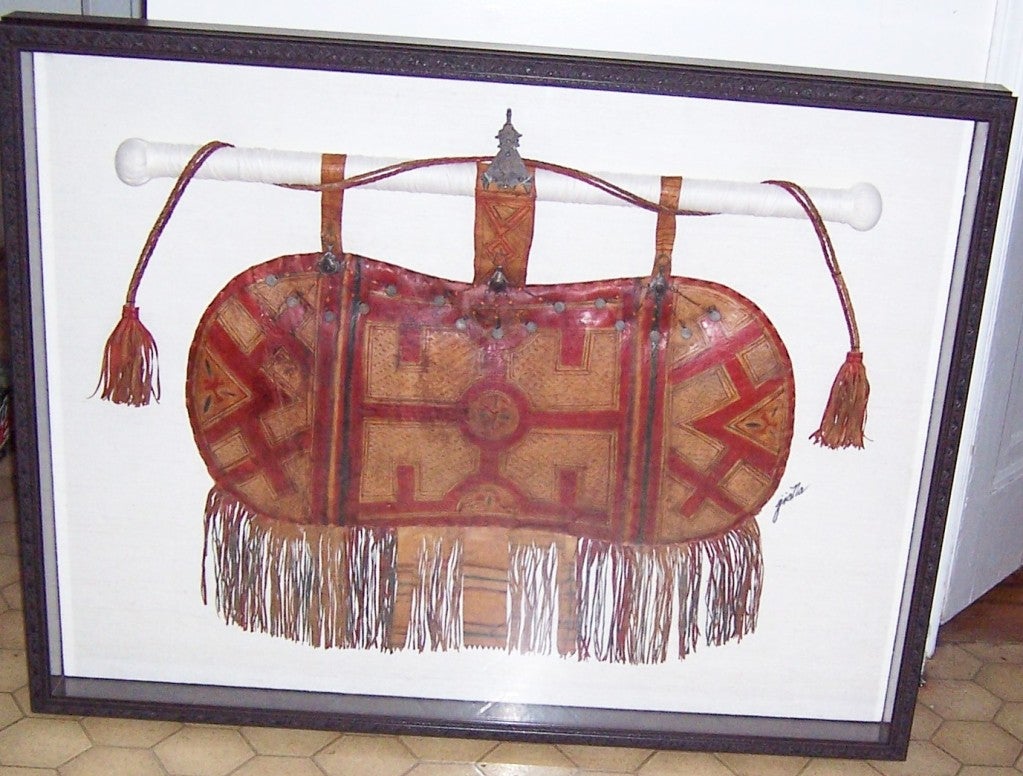 This is an exceptionally handsome, tribal African leather camel's satchel, beautifully framed under glass. The carved wooden frame measures 4 1/2