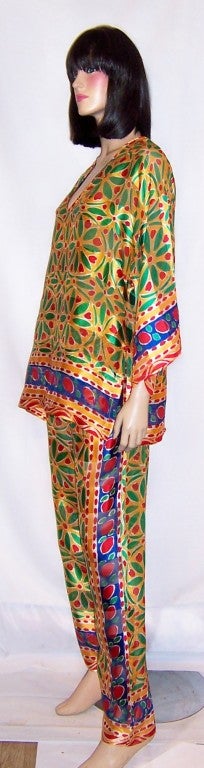 This is a gorgeous and colorful  printed silk ensemble consisting of a loose fitting top and pants with an elasticized waist band. It could be worn as a lounging outfit at home or for an evening out. It has a very ethnic feel about it, possibly