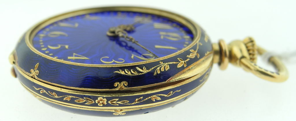 Up for sale is a Patek Philippe ladies18kYG openface pendant watch with diamonds and blue enamel with exquisite  floral scene.  Case  is 28.3mm in diameter and blue enamel dial with applied yellow gold Arabic numerals. Dated circa 1880'.