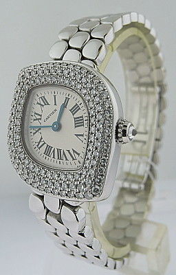 This is a CARTIER, lady's 18k white gold and diamond-set 'NAVETTE'-shaped wristwatch with bracelet. Signed CARTIER, NAVETTE MODEL, REF. 2359, CASE NO. CC 416385. Manufactured in circa 1990. Quartz movement, silvered matte dial, black Roman numerals,