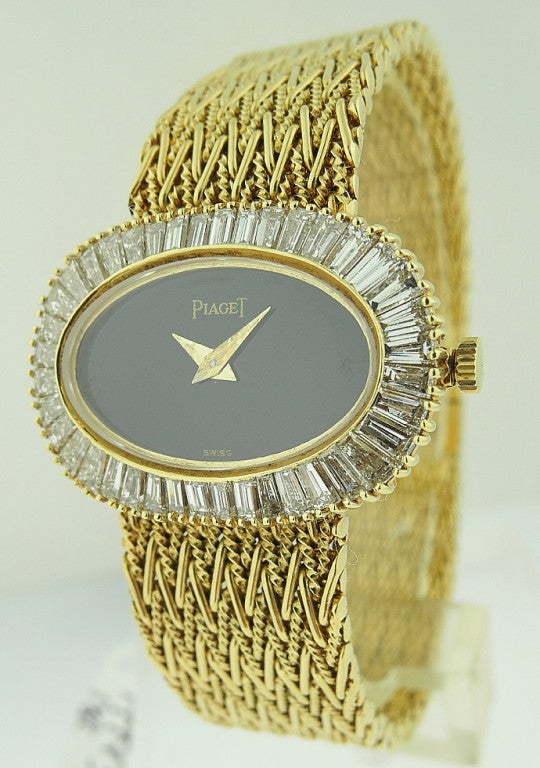 This is a Piaget, 18k yellow gold ladies bracelet watch with black onyx dial & baguette diamonds (3.5ct). Manual wind wristwatch with attached 18k yellow gold bracelet (6 1/2 inches long). Manufactured in circa 1990'. Weight 62gr.