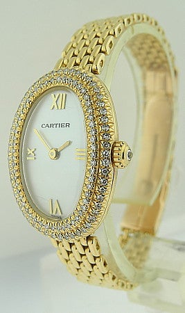 This is a Cartier, 18k yellow gold ladies bracelet wristwatch with 2 rows of diamonds on the bezel and mother of pearls dial. Manufactured circa 1988. This is a quartz watch with 18k yellow gold link bracelet (6 1/2