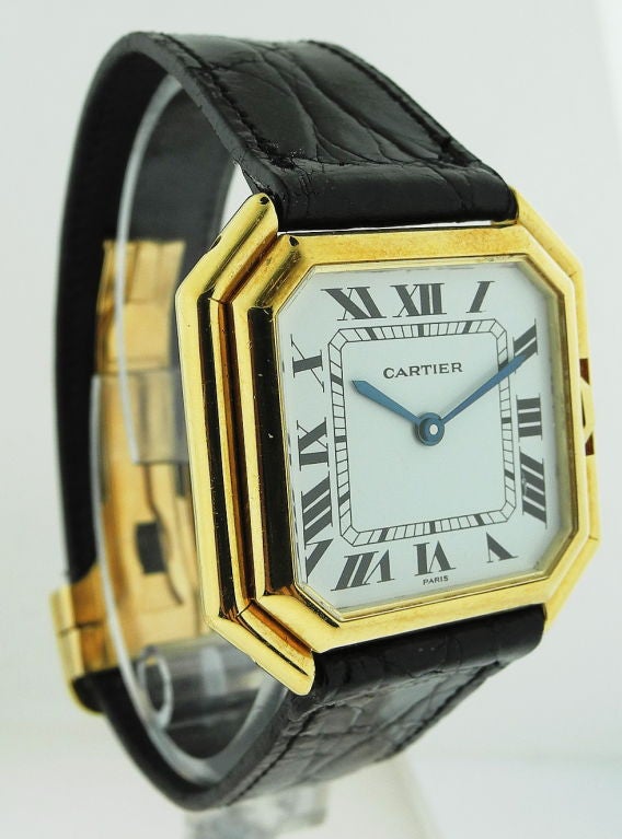 CARTIER – Ceinture Automatic Cartier, Paris, made circa 1970. Fine, octagonal, 18K yellow gold wristwatch with 18K yellow gold Cartier deployant clasp. C. Octagonal, polished, stepped sides, inset crown, case back secured by 4 screws on the band. D.