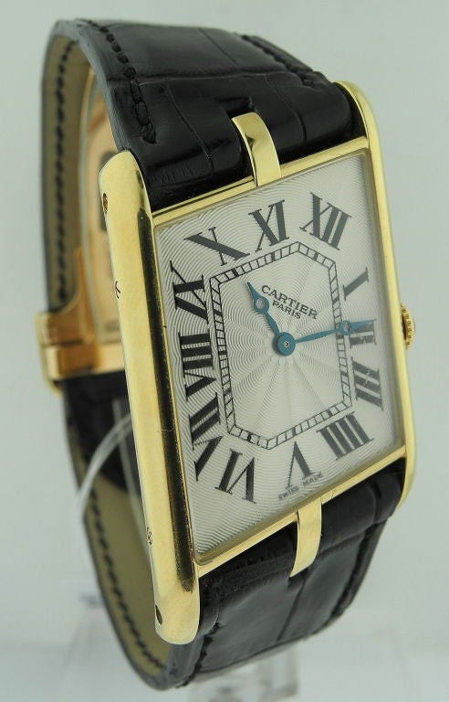 Cartier, Paris. A fine and rare 18K gold limited edition asymmetric Tank wristwatch Tank Parallélogramme, Collection Privée, Ref. 2842. No. 135 / 150 17-jewel manual winding movement, lozenge form guilloché silvered dial with bold roman chapters