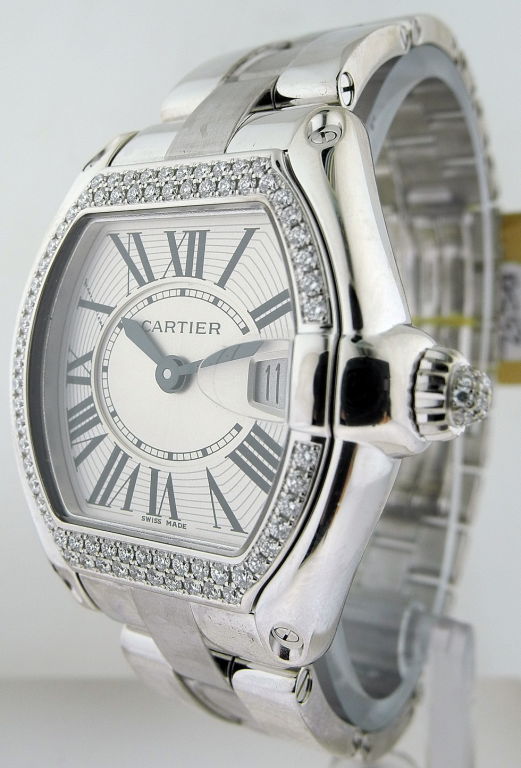 Up for sale is a CARTIER, a lady's 18K white gold and diamond tonneau wristwatch with bracelet. Signed CARTIER, ROADSTER, Case # 76960CE AND 2723, Circa 2007 Cal. 688 quartz movement, silvered matte dial, Roman numerals on faux engine-turned chapter