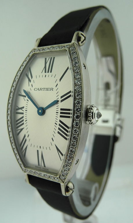 Cartier lady's 18k white gold tonneau shaped 