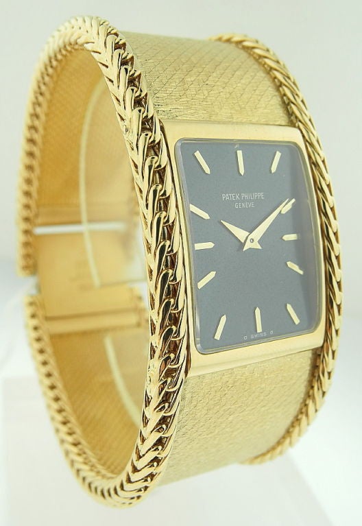 This is a Patek Philippe, fine, rare and heavy 18K yellow gold rectangular bracelet watch. Signed Patek Philippe, Genev. Case No. 2732925, Ref. 4241, manufactured in 1974 Nickel-finished lever movement, blue metallic dial with applied gold baton