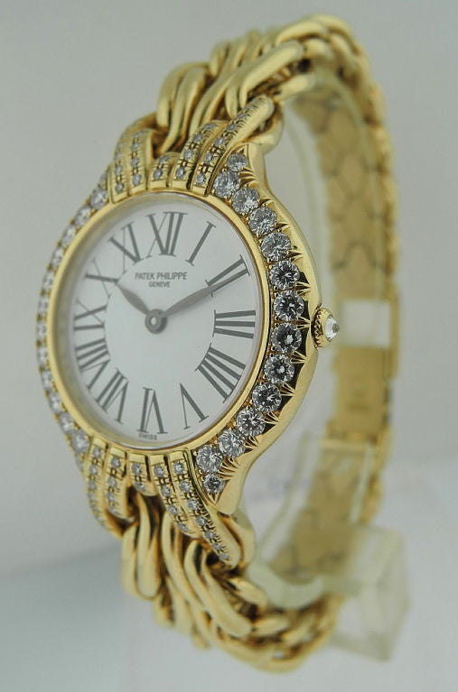 This is Patek Philippe. A lady's 18 carat gold and diamond set quartz wristwatch. Signed Patek Philippe, ref. 4836/003, movement no. Manufactured in circa late 1990' . With quartz movement, the white dial with Roman numerals and blued steel hands,