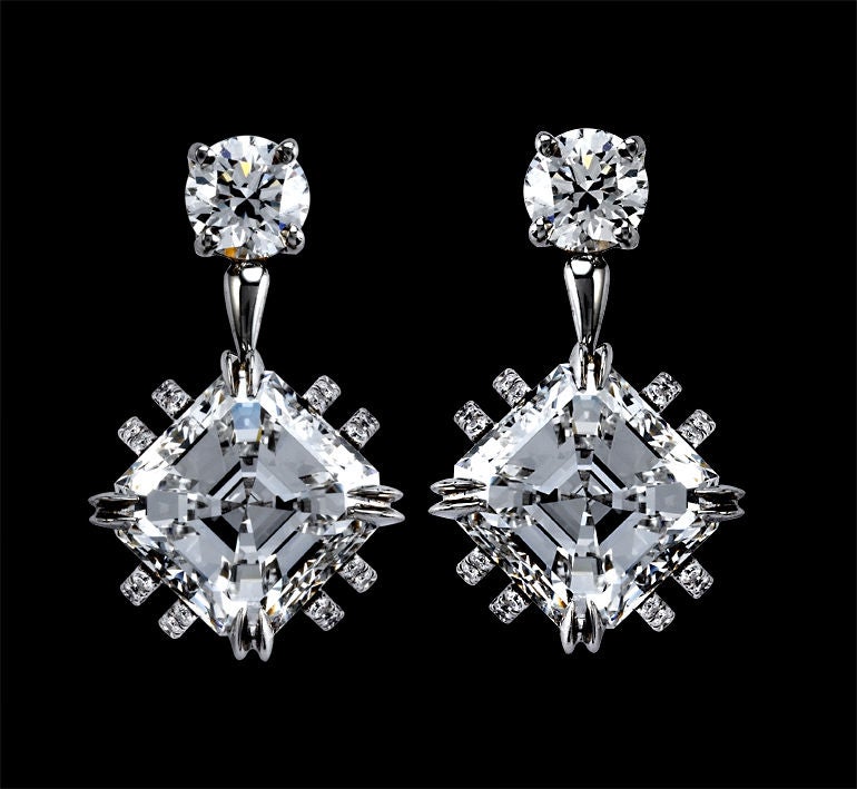 *Please contact us for more information on this piece or on creating your own Alexandra Mor custom Design. 

A pair of Alexandra Mor earrings each featuring a 3.41 carat Asscher-cut Diamond suspended from a 0.42 carat round Diamond, and surrounded