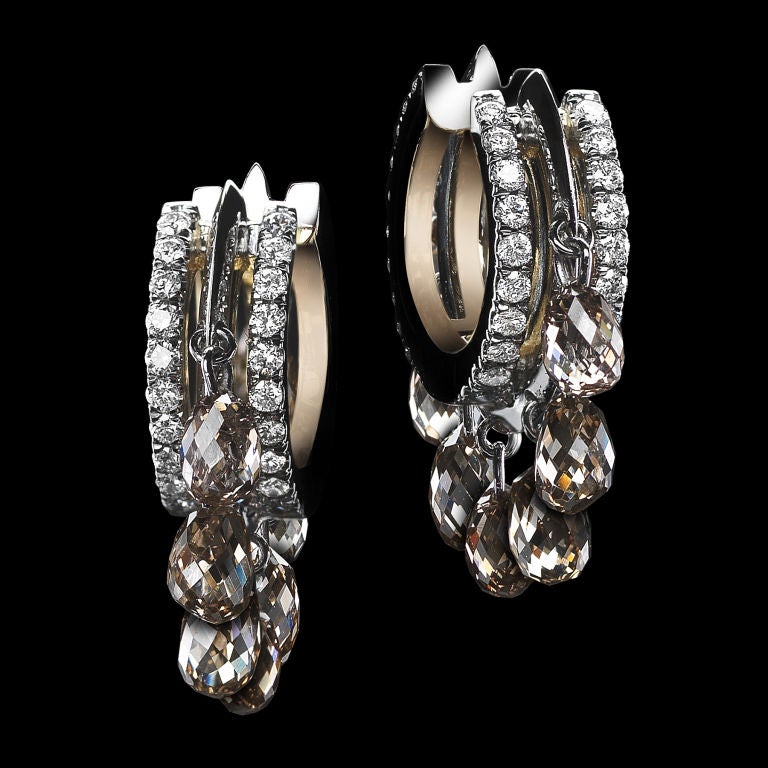 *Please contact us for more information on this piece or on creating your own Alexandra Mor custom Design. 

A pair of Alexandra Mor close-fitting Diamond oval shaped hoop earrings featuring ten natural Champagne Diamond-briolettes and Alexandra