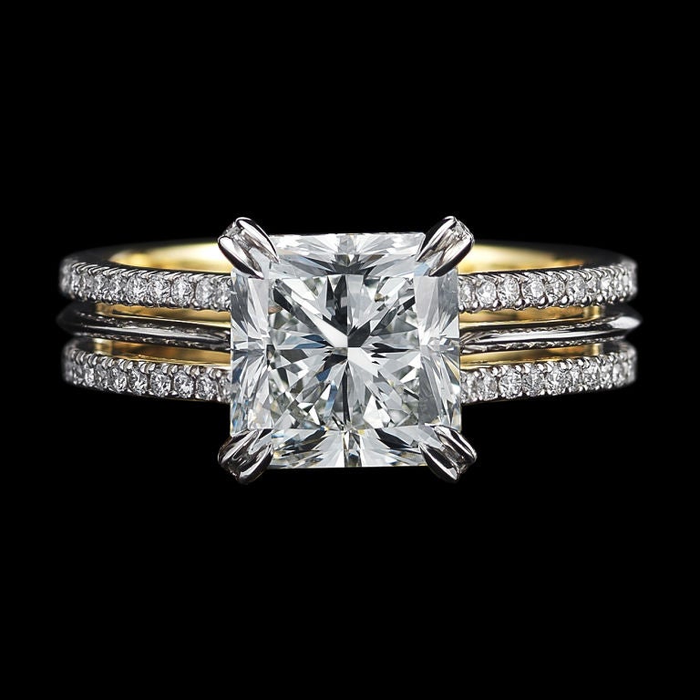 Alexandra Mor Signature diamond ring featuring a radiant cut center diamond with accompanying GIA report stating color is G and clarity is VS1. , detailed with Alexandra Mor’s signature 1mm floating Diamond melee and knife-edged wire. Ring is set in
