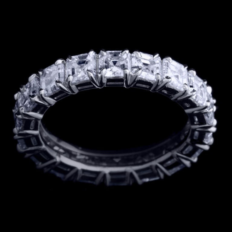 *Please contact us for more information on this piece or on creating your own Alexandra Mor custom Design. 

A 4.75 carat Asscher-cut Diamond eternity band crowned by Alexandra Mor knife-edged split-prong gallery. Set in platinum. Also available in