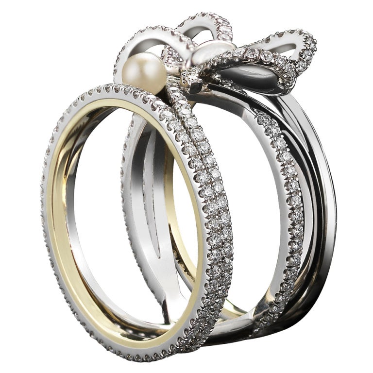 Contemporary Pearl Diamond Platinum Bow Ring For Sale