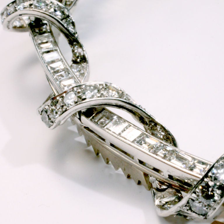 An unique matched pair of diamond hair clips, especially designed for Linda Horn, by the original Fred Leighton, from an 19th Century crown. A half circle of brilliant square-shaped channel set diamonds encircled with a ribbon of round channel set