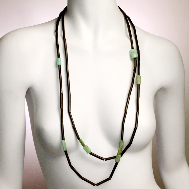 From Danish designer Gerda Lynggard, a one-of-a-kind long necklace.  A continuous strand of black horn tubes separated by natural turquoise stones.  Can be worn across the body as one long piece or wrapped in a double or triple strand.  Can be worn